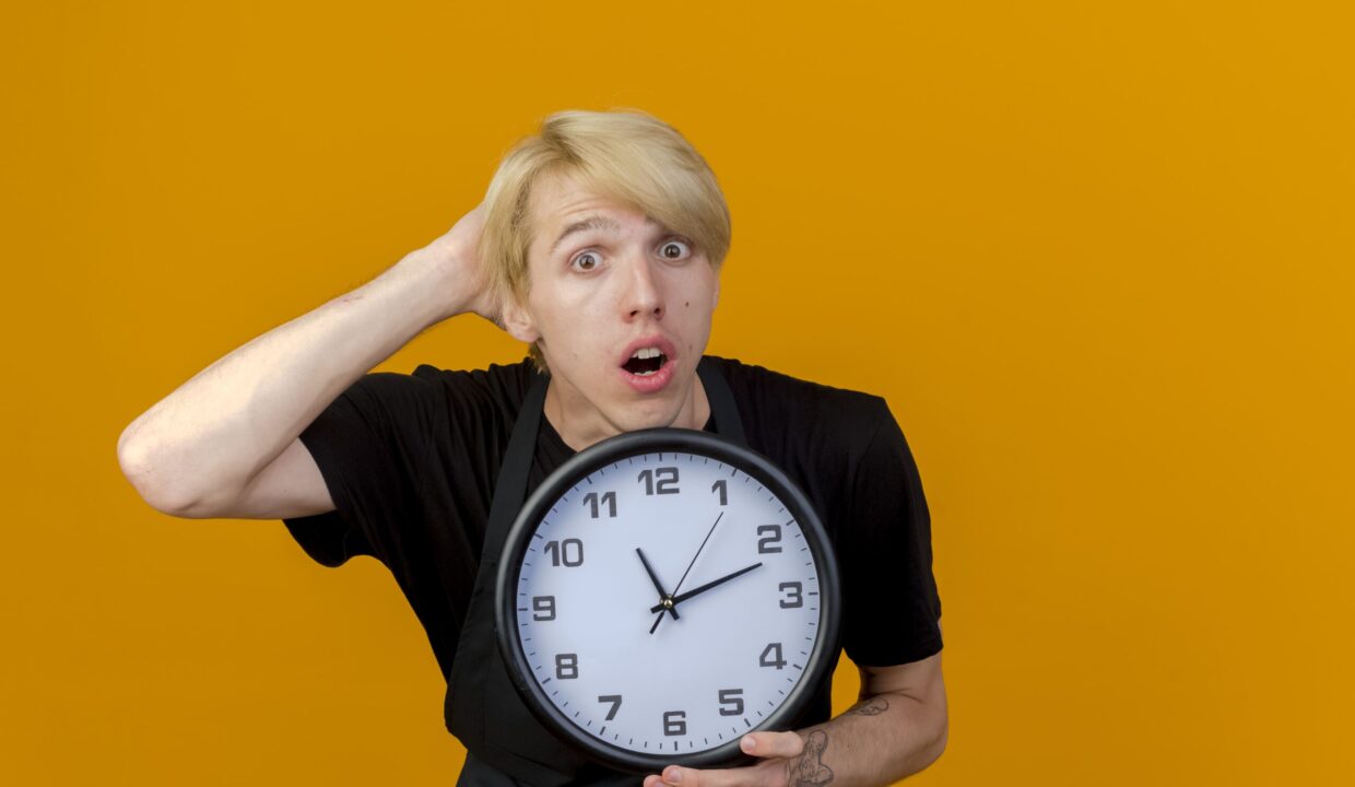 Man holding a clock