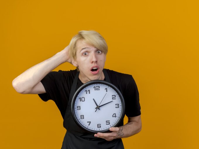 Man holding a clock